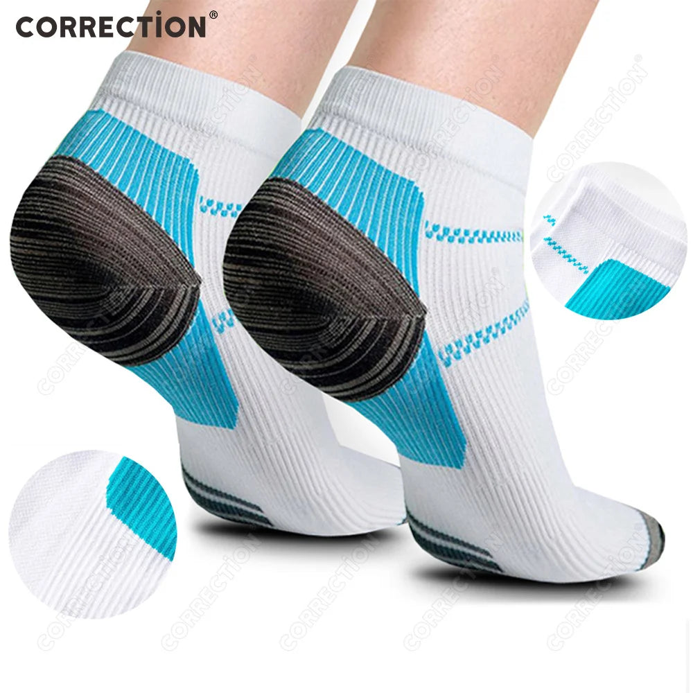 Pair of white compression socks with blue accents and black heel grips for plantar fasciitis relief
