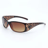 Gafas marrones con montura cuadrada y patrón floral detallado.