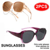 A pair of rose gold wrap-around sunglasses shown alongside a pair of purple-tinted sunglasses.