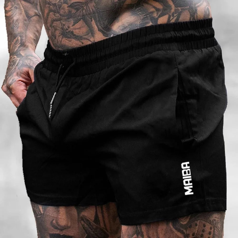 Black men's stretch performance drawstring shorts worn by a model.