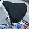 Close-up view of a black breathable 3D mesh bicycle saddle cushion with various color options.