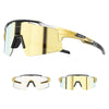 A pair of gold-tinted photochromic cycling sunglasses with black frames shown from the side and front views.