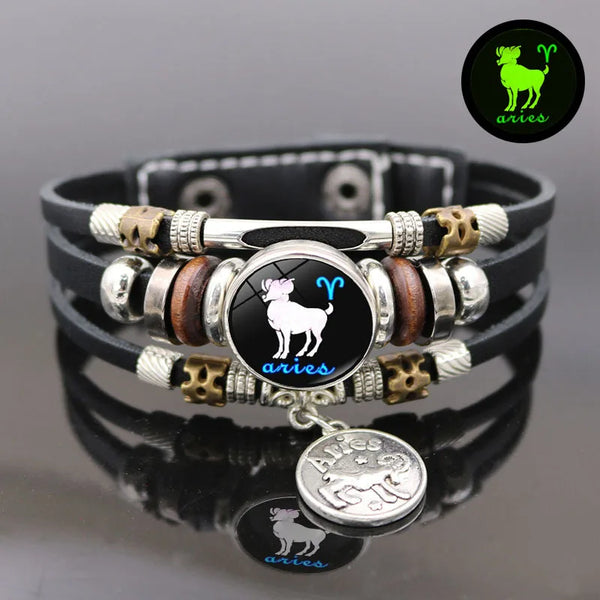 A black leather bracelet featuring a silver pendant with the Aries zodiac symbol and constellation design.