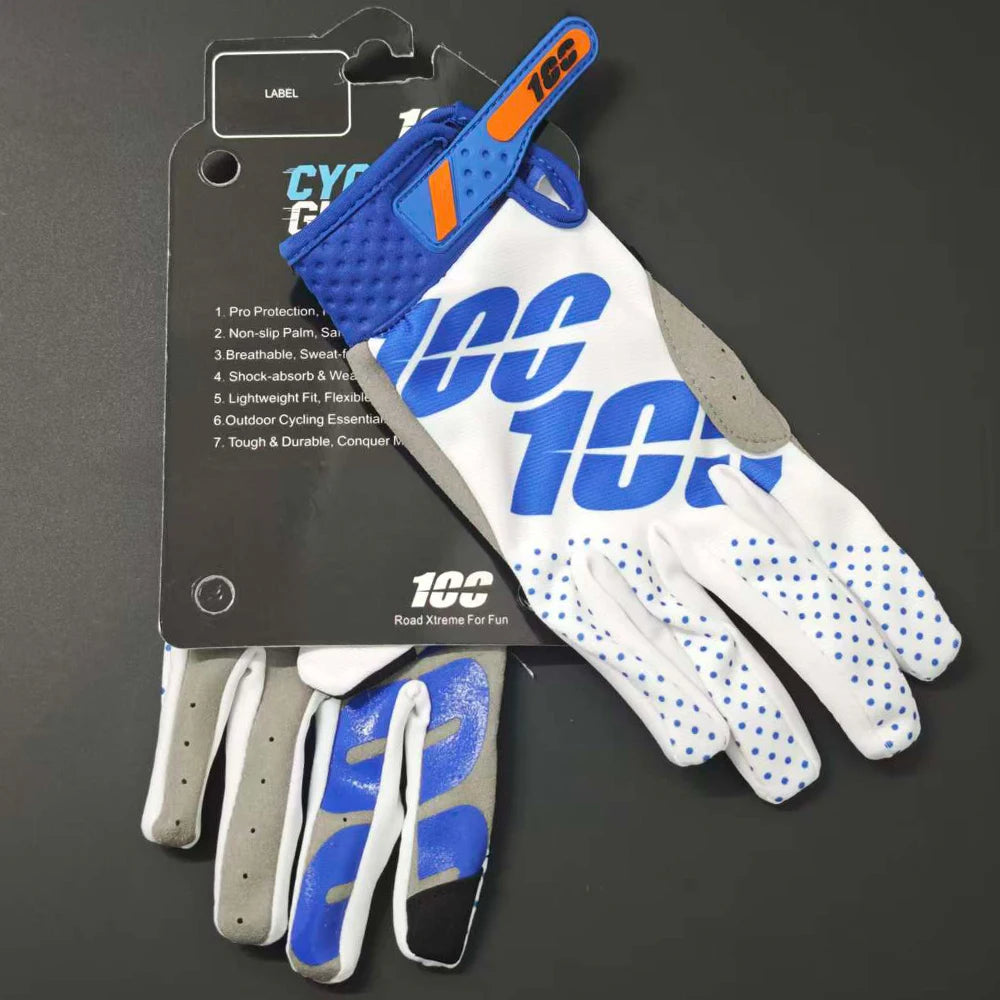A pair of blue and white cycling gloves with an orange accent are displayed next to their packaging.