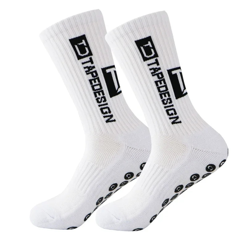 A pair of white anti-slip performance sports socks with black text and dots.