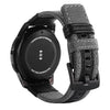 A black Samsung Gear S3 Frontier watch with a nylon quick release band.