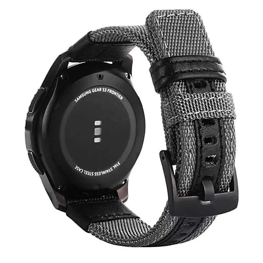 A black Samsung Gear S3 Frontier watch with a nylon quick release band.