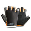 A pair of black gym workout gloves with orange accents shown from above.