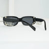 Black sunglasses with spiked rivets and silver chain accents