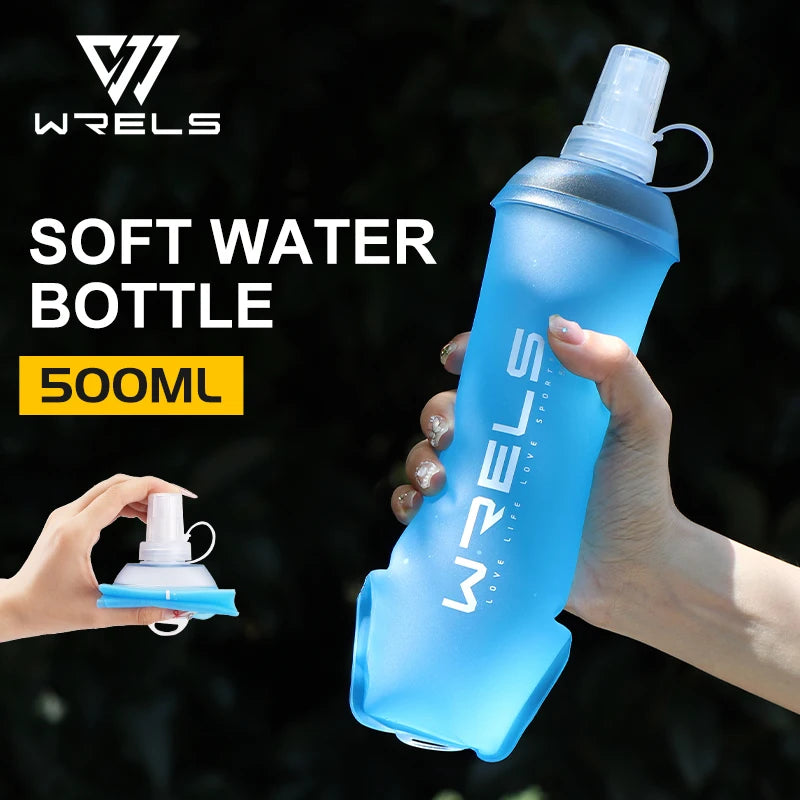 A hand holds a light blue soft water bottle with a clear cap against a dark, leafy background.