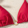 A red tie-side bikini top is shown against a light background.