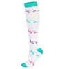 White compression socks with purple heart patterns and teal cuffs