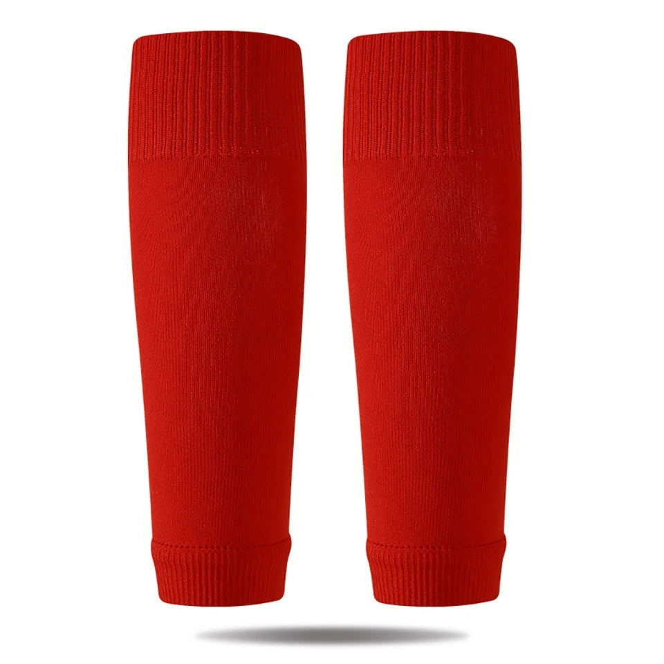 A pair of red professional compression soccer and sports sleeves.