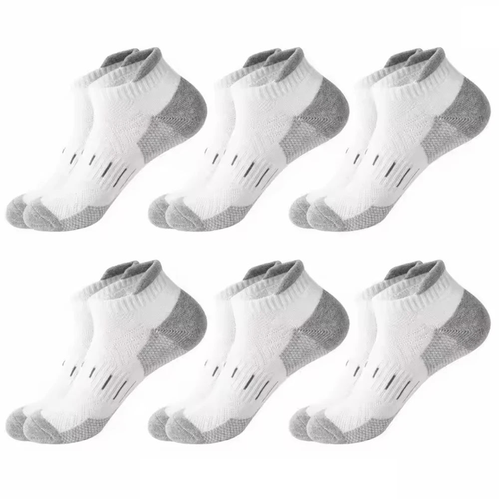 A pack of six athletic mesh ankle socks in white and gray patterns.