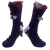 Pair of dark navy knit socks featuring a crocodile design for holiday parties
