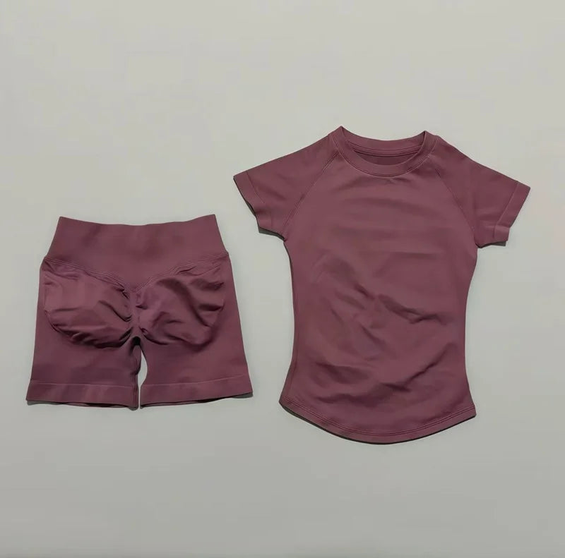 A mauve seamless yoga set for women featuring a short sleeve top and matching workout leggings.