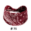 A burgundy boho print cotton headband tied in a knot.