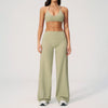 A woman wearing a light olive green women's premium fitness tracksuit top and matching pants.