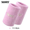A pair of pink knitted sport wristbands shown flat, measuring 11x8cm.