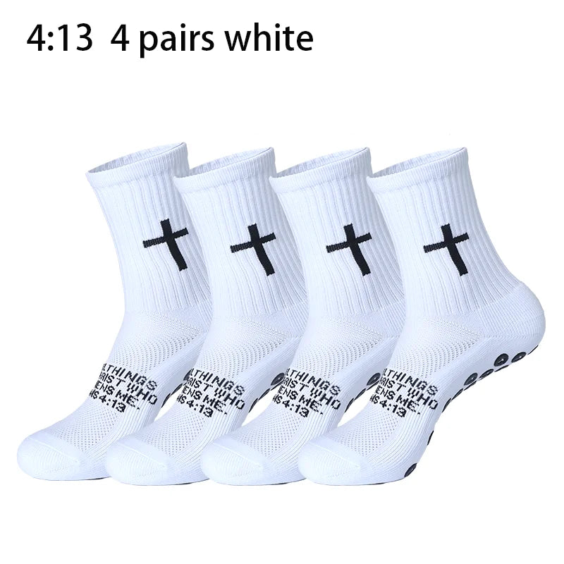 Four pairs of white prayer and cross grip sports socks shown in a row.
