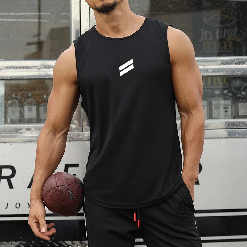 A muscular man wearing a black sleeveless sports tank top and black athletic pants, holding a brown leather football.