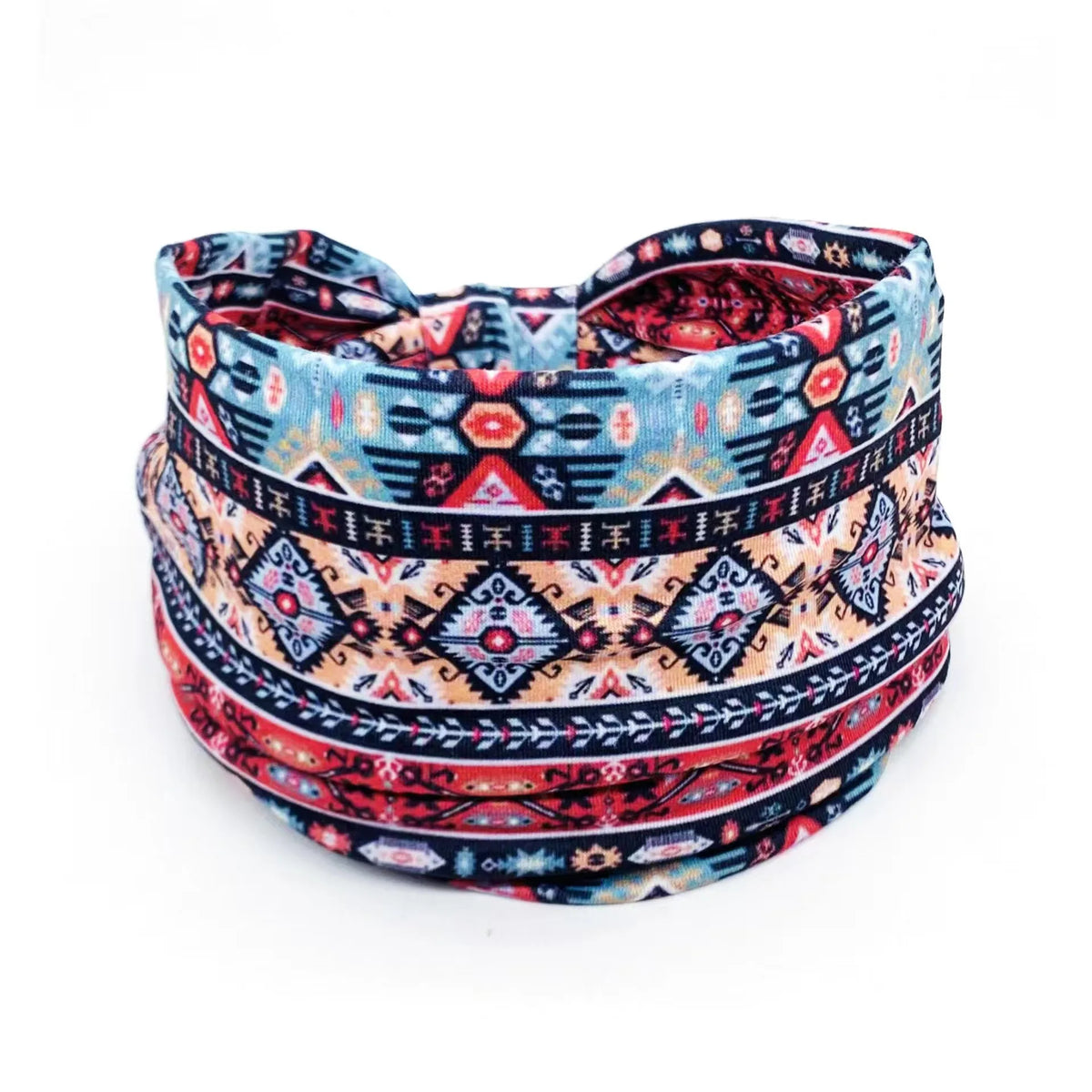 A close-up of a bohemian stretch cotton headband featuring geometric patterns in blue, red, and black.