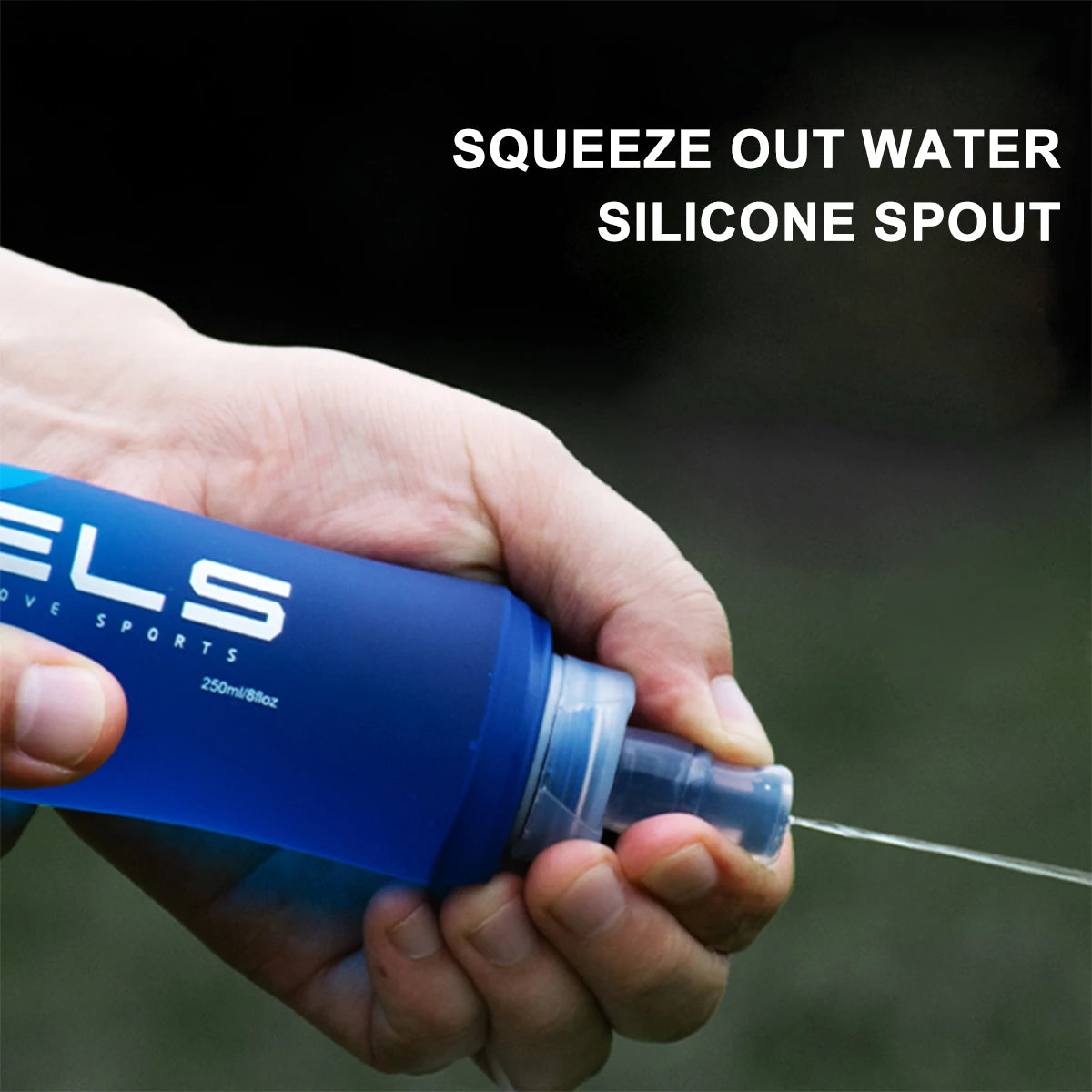 A hand squeezes water out of a blue silicone spout bottle for outdoor or fitness use.