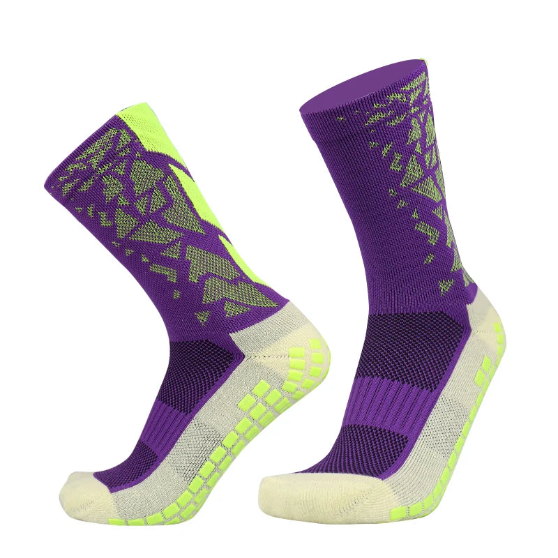 Purple and neon yellow patterned anti-slip silicone football socks shown from the side.