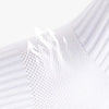 Close-up of white men's athletic soccer socks with a textured, ribbed pattern.