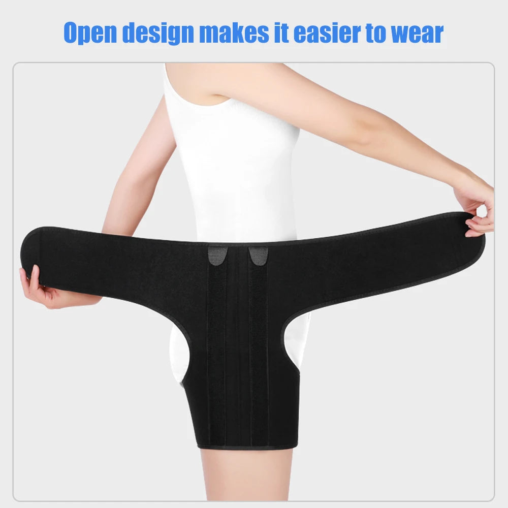 Black compression support brace for the groin and thigh, shown being worn on a person's lower body.