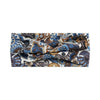 A close-up of a bohemian vintage print fabric featuring blue, brown, and cream patterns.