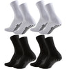 A set of white and black athletic grip socks shown from the side.