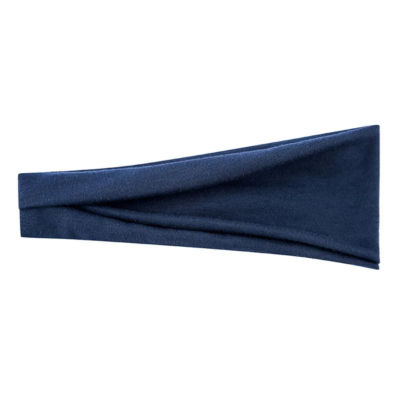 Un bandeau élastique bleu foncé plié et présenté sur un fond blanc.