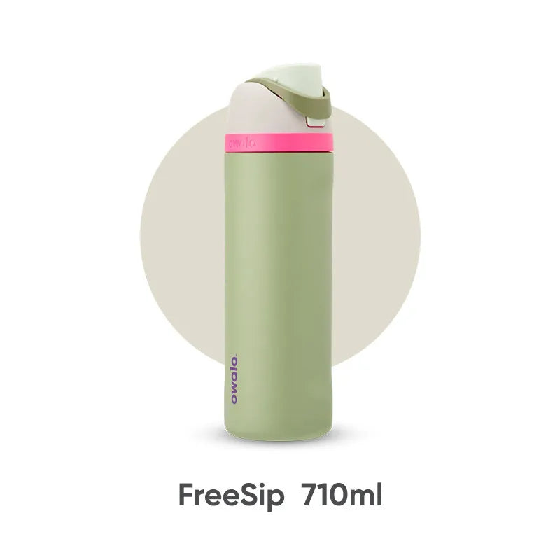 A light green insulated tumbler with a pink lid and straw, shown vertically.