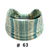 A beige and teal striped cotton turban headband for workout or yoga.
