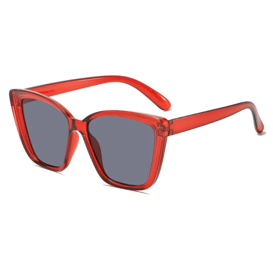 Red cat eye vintage sunglasses with gradient lenses shown against a white background