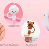 A set of cute silicone straw covers in pink and white, demonstrating leakproof and dustproof features.