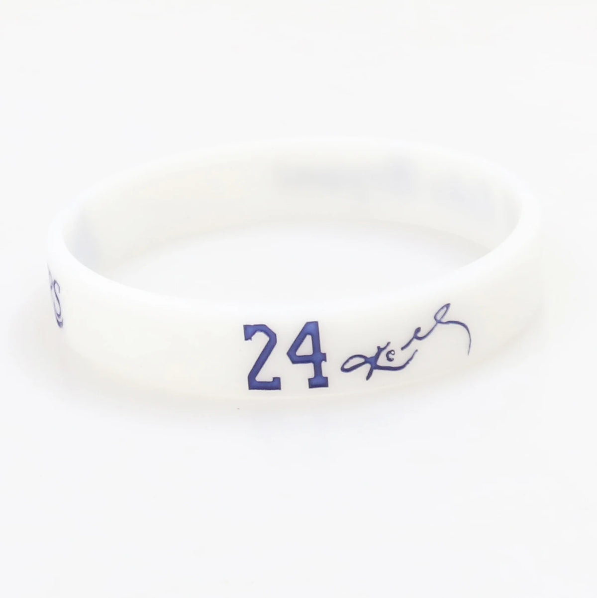 A white silicone wristband with the number 24 and a signature engraved on it.