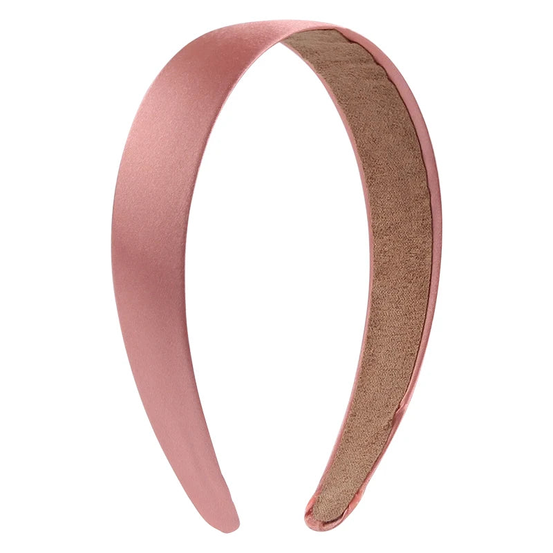 A pair of solid satin hair bands in a dusty rose color shown against a white background.