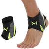 Black compression ankle support sleeve worn on a foot and ankle.