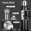 Botella térmica negra con tapa separadora de acero inoxidable y cubierta de taza.