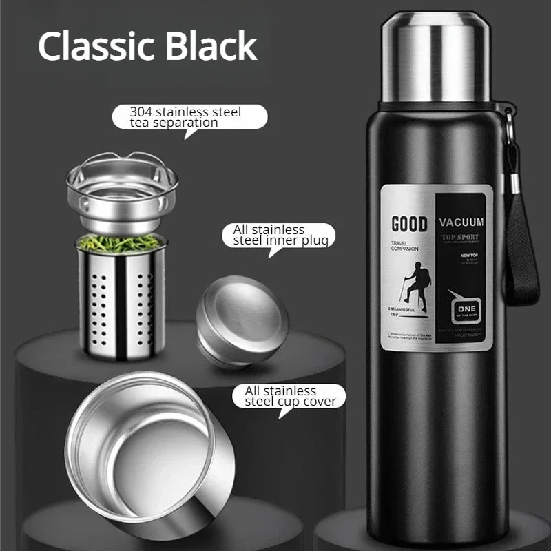 Botella térmica negra con tapa separadora de acero inoxidable y cubierta de taza.