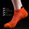 Orange athletic ankle socks with ventilation mesh and stable arch support