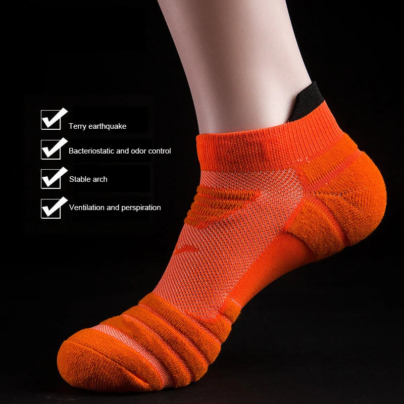 Orange athletic ankle socks with ventilation mesh and stable arch support