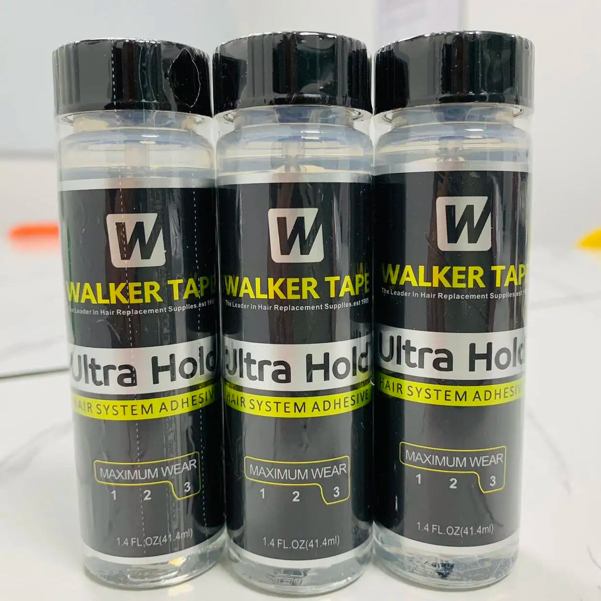 Three bottles of Walker Tape Ultra Hold lace wig glue for hair replacement supplies