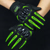 A pair of black motorcycle riding gloves with neon green accents being worn on a hand.