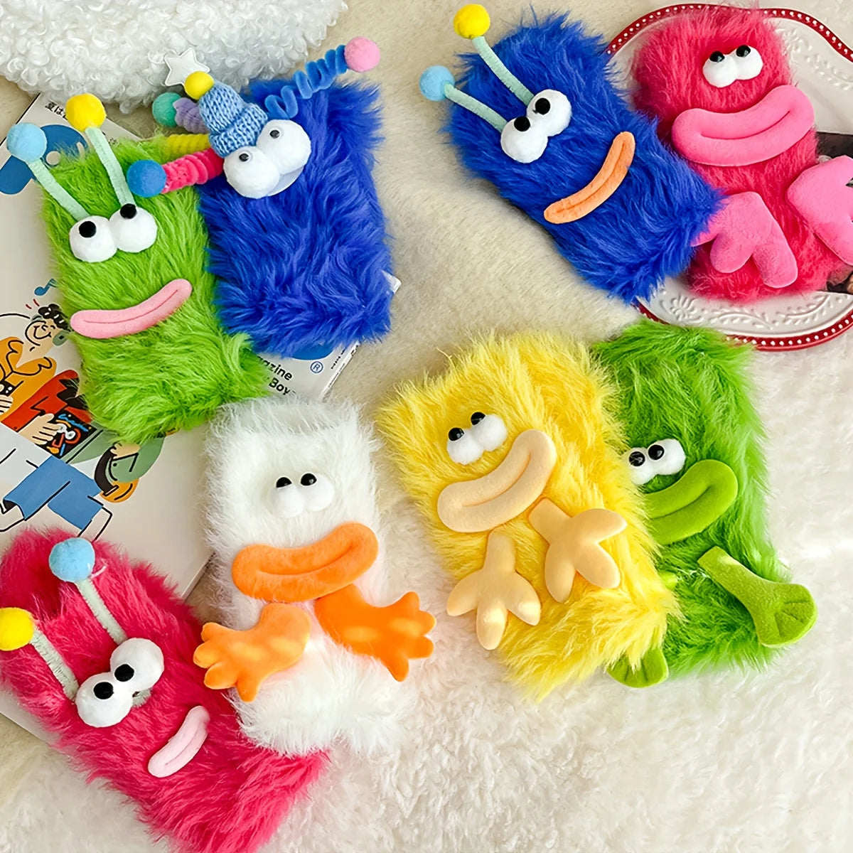 A collection of colorful plush caterpillar floor socks featuring bright colors like blue, green, yellow, and pink.