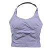 A light purple seamless performance yoga and gym tank top worn by a person.