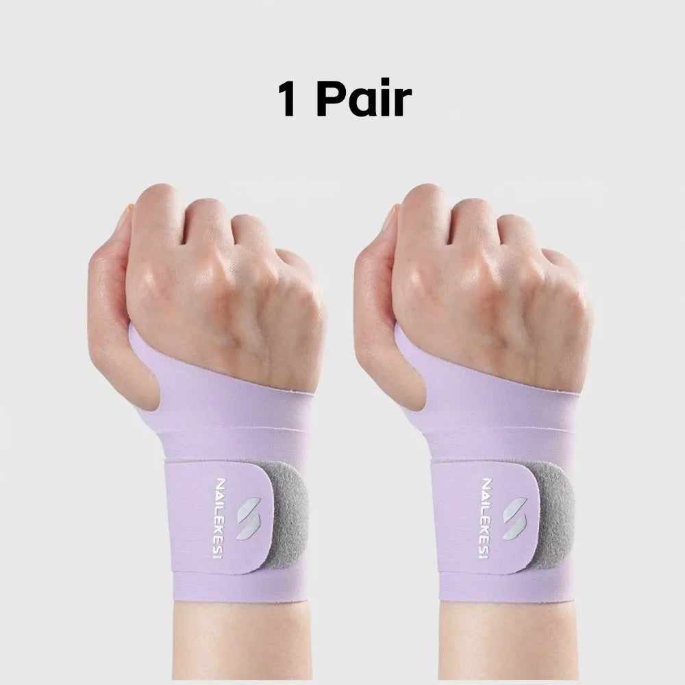 A pair of lavender wrist compression braces shown on hands for sports and workout recovery.