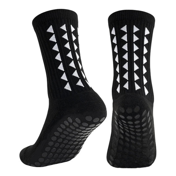 A pair of black non-slip athletic grip socks with white triangular patterns.